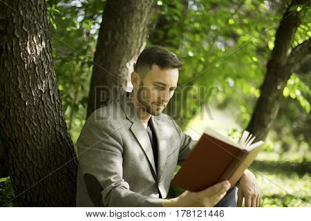 middle aged man rading book in park