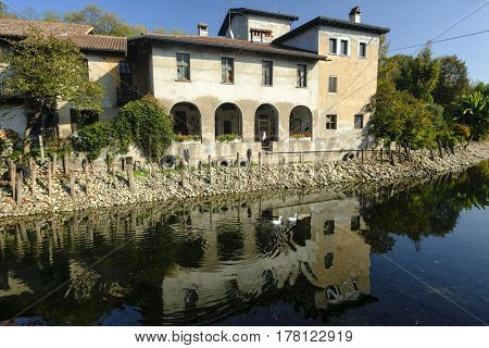 Country house along the Naviglio Grande of Turbigo (Milan Lombardy Italy) at fall with geese