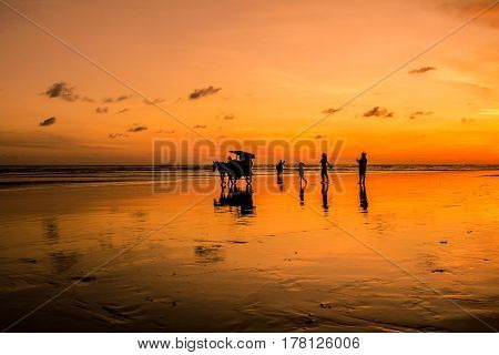 Sunset and silhouette at Parangtritis Beach, Central Java Indonesia