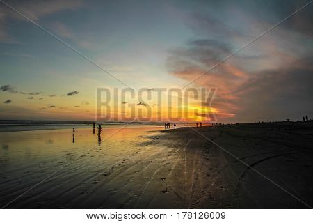 Sunset and silhouette at Parangtritis Beach, Central Java Indonesia