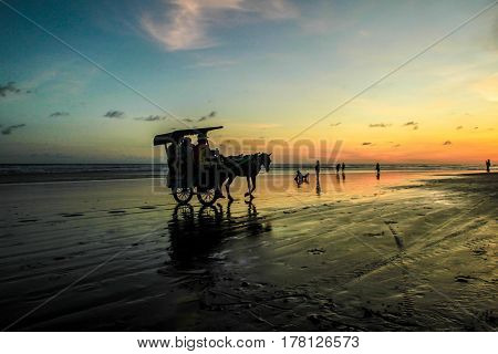Sunset and silhouette at Parangtritis Beach, Central Java Indonesia