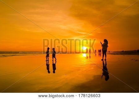 Sunset and silhouette at Parangtritis Beach, Central Java Indonesia