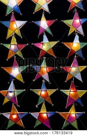 Multi colored star lamps and background .