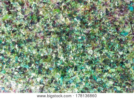 Particle of shattered green glass texture background