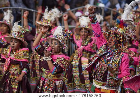 ORURO, BOLIVIA - FEBRUARY 25, 2017: Tinkus dancers in colourful costumes performing at the annual Oruro Carnival. The event is designated by UNESCO as being Intangible Cultural Heritage of Humanity.