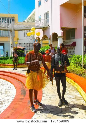 Point-a-Pitre, Guadeloupe - February 09, 2013: The local black men preparing at the Caribbean Carnival at Point-a-Pitre, Guadeloupe on February 09, 2013