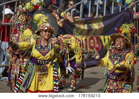ORURO, BOLIVIA - FEBRUARY 25, 2017: Tinkus dancers in colourful costumes performing at the annual Oruro Carnival. The event is designated by UNESCO as being Intangible Cultural Heritage of Humanity.