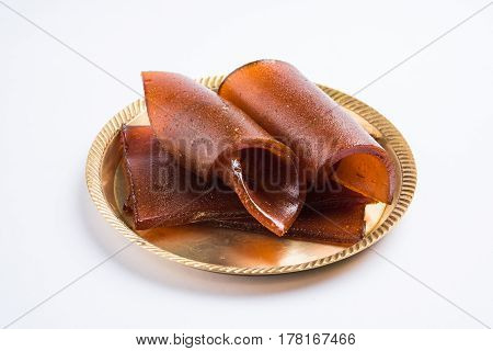 indian alphonso mango's dried jelly called mango papad or mango poli or slab or cake, traditional maharashtrian recipe