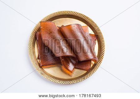 indian alphonso mango's dried jelly called mango papad or mango poli or slab or cake, traditional maharashtrian recipe
