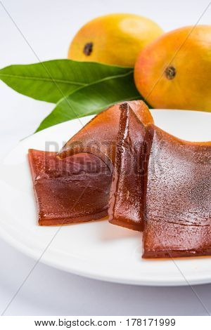 indian alphonso mango's dried jelly called mango papad or mango poli or slab or cake, traditional maharashtrian recipe
