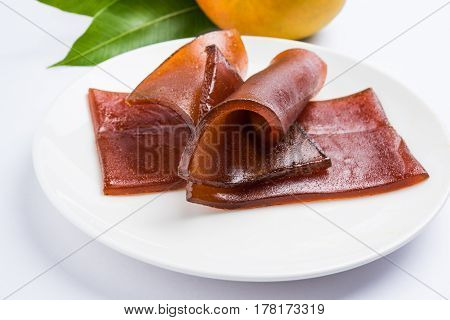 indian alphonso mango's dried jelly called mango papad or mango poli or slab or cake, traditional maharashtrian recipe