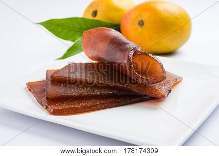indian alphonso mango's dried jelly called mango papad or mango poli or slab or cake, traditional maharashtrian recipe
