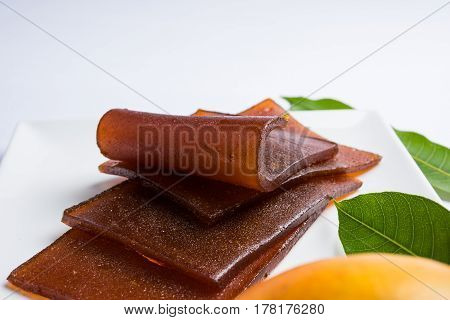 indian alphonso mango's dried jelly called mango papad or mango poli or slab or cake, traditional maharashtrian recipe