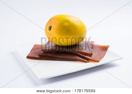 indian alphonso mango's dried jelly called mango papad or mango poli or slab or cake, traditional maharashtrian recipe