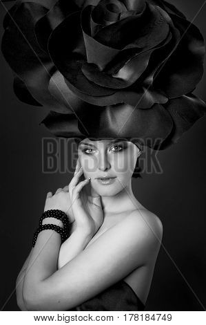 black and white portrait of a girl in a dark roses suit