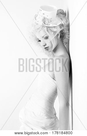 black and white portrait of a sensual girl in a hat with a veil