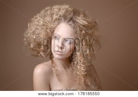 portrait of beautiful curly girl on a beige background