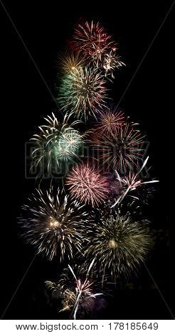 long exposure of multiple fireworks against a black sky