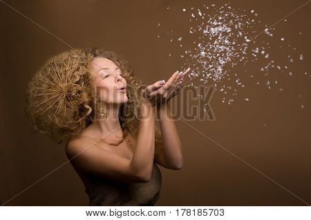 portrait of beautiful curly girl on a beige background