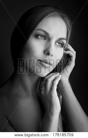 monochrome Portrait of beautiful woman on beige background