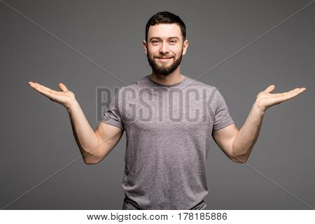 Portrait Of A Smart Serious Young Man In Casual Clothes Standing
