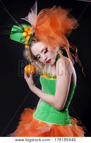 portrait of a girl with fashion makeup on a black background