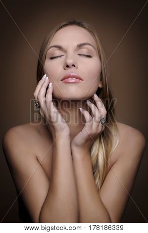 Portrait of beautiful woman on beige background