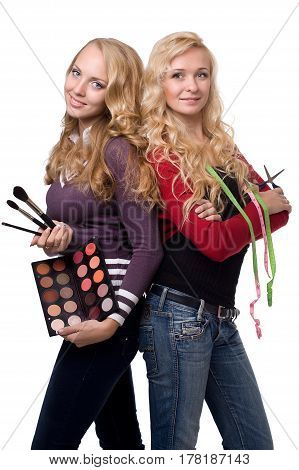 Portrait of two girls, visagiste and tailor. isolated on a white background.