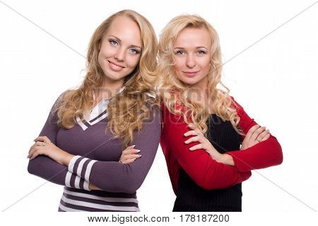 two beautiful blond woman sisters with styled blond hair