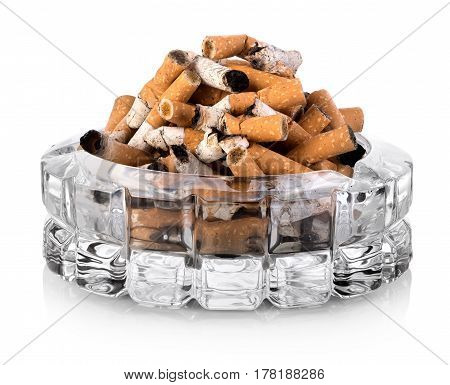 Butts in a glass ashtray isolated on white