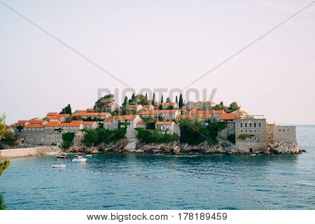 Island of Sveti Stefan close up at sunset. Montenegro, the Adriatic Sea, the Balkans.