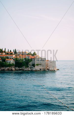 Island of Sveti Stefan close up at sunset. Montenegro, the Adriatic Sea, the Balkans.