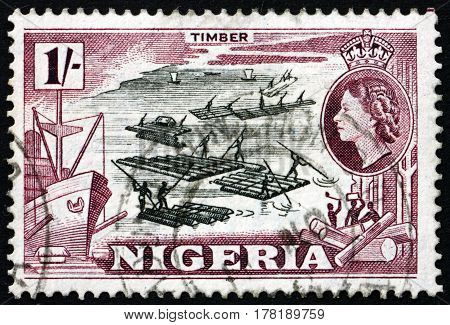 NIGERIA - CIRCA 1953: a stamp printed in Nigeria shows Logging circa 1953