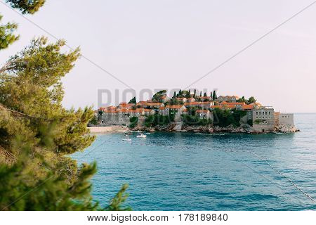 Island of Sveti Stefan close up at sunset. Montenegro, the Adriatic Sea, the Balkans.