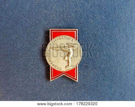 USSR - CIRCA 1979: Badge with a picture of a gymnast and the inscription 