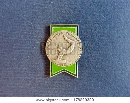 USSR - CIRCA 1979: Badge with a picture of a gymnast and the inscription 