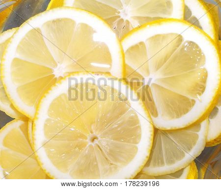 Looking at slices of juicy lemon felt its freshness taste and aroma