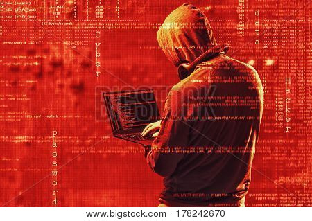 Internet Crime Concept. Dangerous Hacker, In Hoodie Shirt And Dark Red Digital Background Around, St