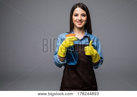 Housekeeper Woman Holding Bottle With Cleaner Liquid And Show Thumb Up. Isolated Portrait Of Smiling