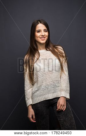 Portrait Of Pretty Young Woman With Long Hair In White Shirt Sitting On Stool Chair