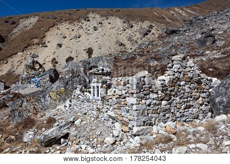 View of Nepalese Settlement with unfinished Stone House made according to traditional manual work technology without using tools and cement in Mountain Area of Nepal Country.