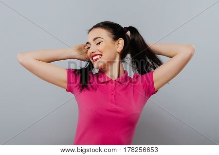 Closeup portrait of a beautiful young woman with carefree expression.