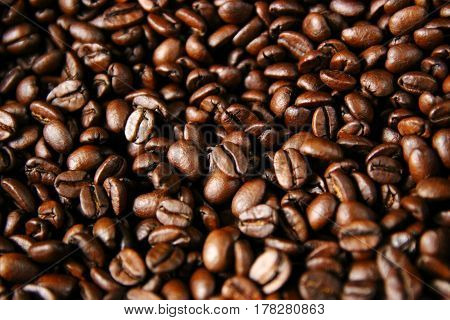Closeup of roasted coffee beans after roasting in a drum type coffee roaster  