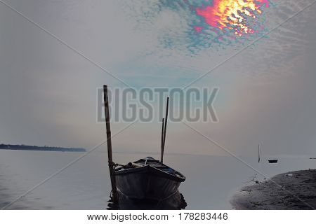 Lonely boat in the mighty Brahmaputra river at evening