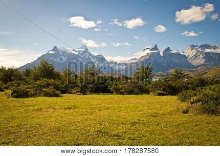 Green and perfet grass sourrounded by mountains in Chilean Patagonia