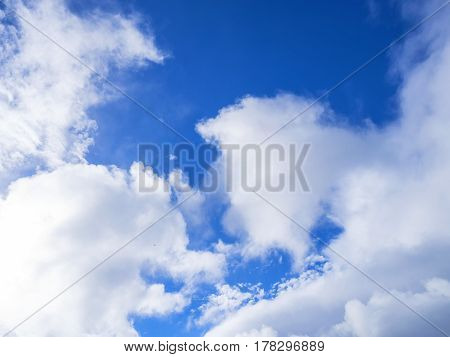 blue sky background with white clouds .