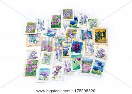 A Stamp Printed In Japan Shows Violet Flower Collection.