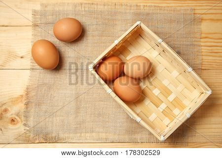 Brown Eggs In Basket With Homespun Fabric Close Up
