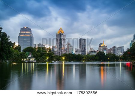 Bangkok Thailand - september 04 2016: evening scene of Bangkok skyline at Lumphini Park in Bangkok. Lumphini Park is a park in Bangkok