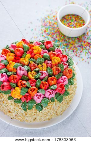 Buttercream flower tulip cake beautiful festive cake decorated with colorful cream flowers for spring holidays